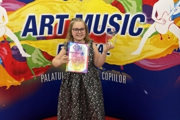 8-year-old girl from Ruse Anastasia Markova with an award from an international music competition in Bucharest